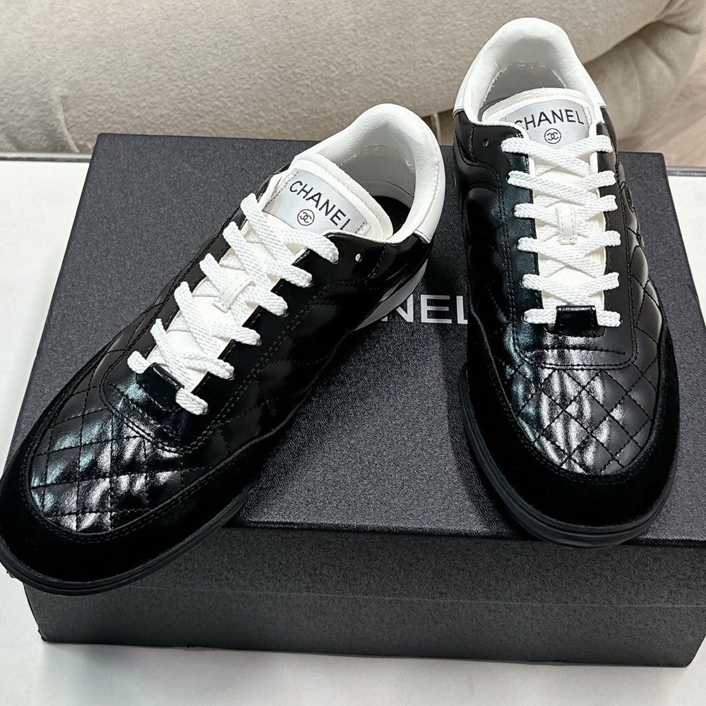 Women's Chanel Black Quilted Patent Leather White Lace-Up Sneakers - Picture 1 of 7